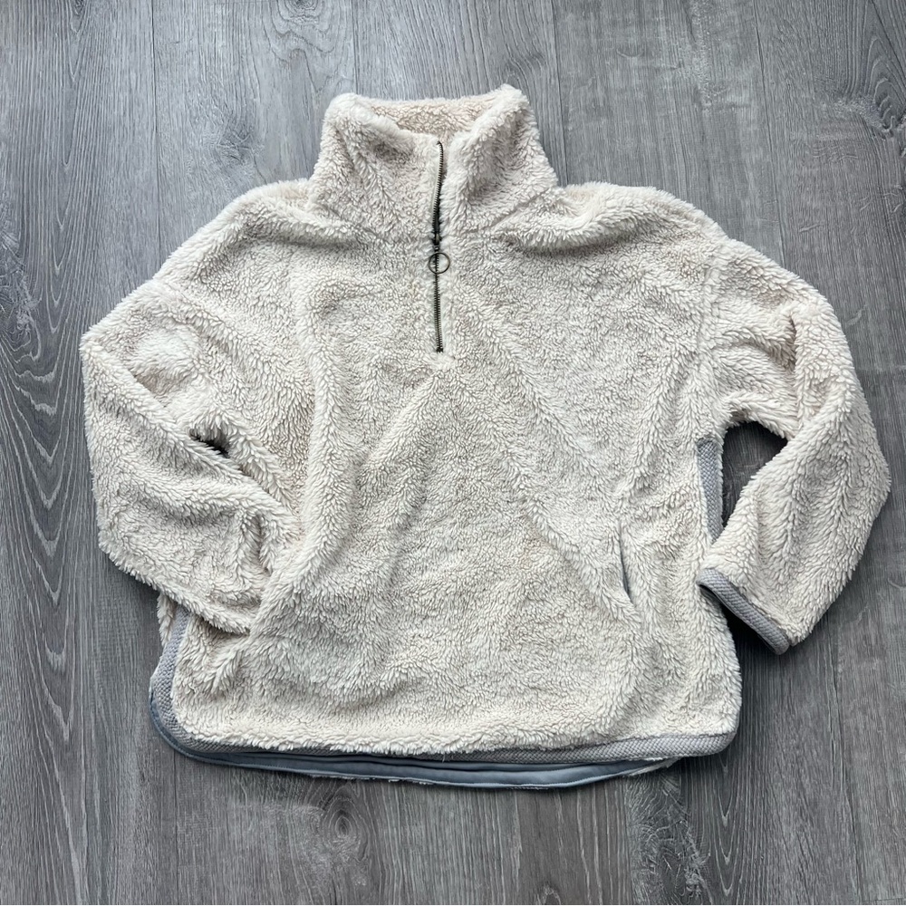 Cream colored 3/4 Zip Sherpa with silk interior